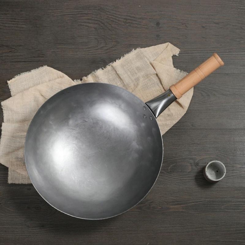 https://toroscookware.com/cdn/shop/products/134-inch-traditional-round-bottom-uncoated-iron-wok-414275_1024x1024.jpg?v=1601222986